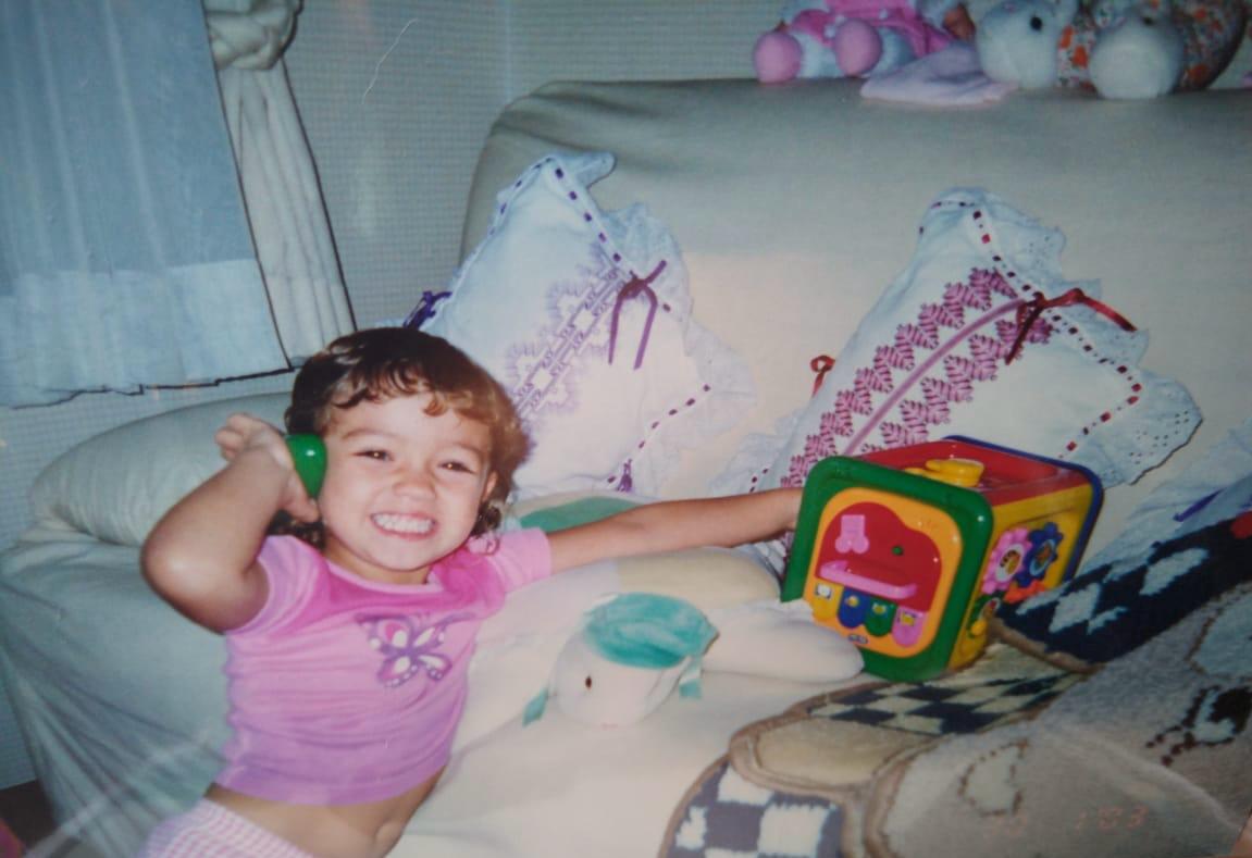 Baby Giovanna playing with toys
